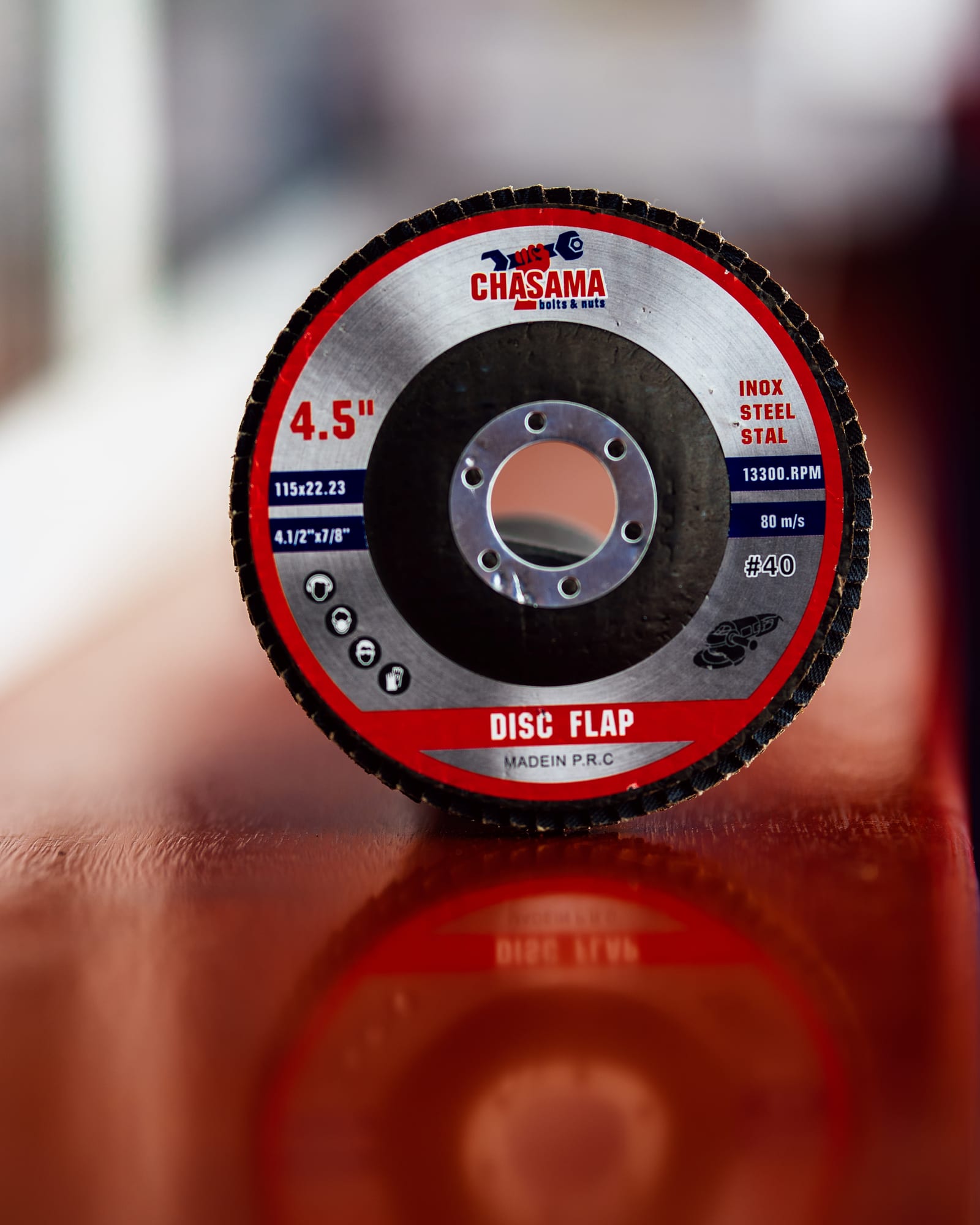 Chasama flap disc standing upright on a reflective counter
